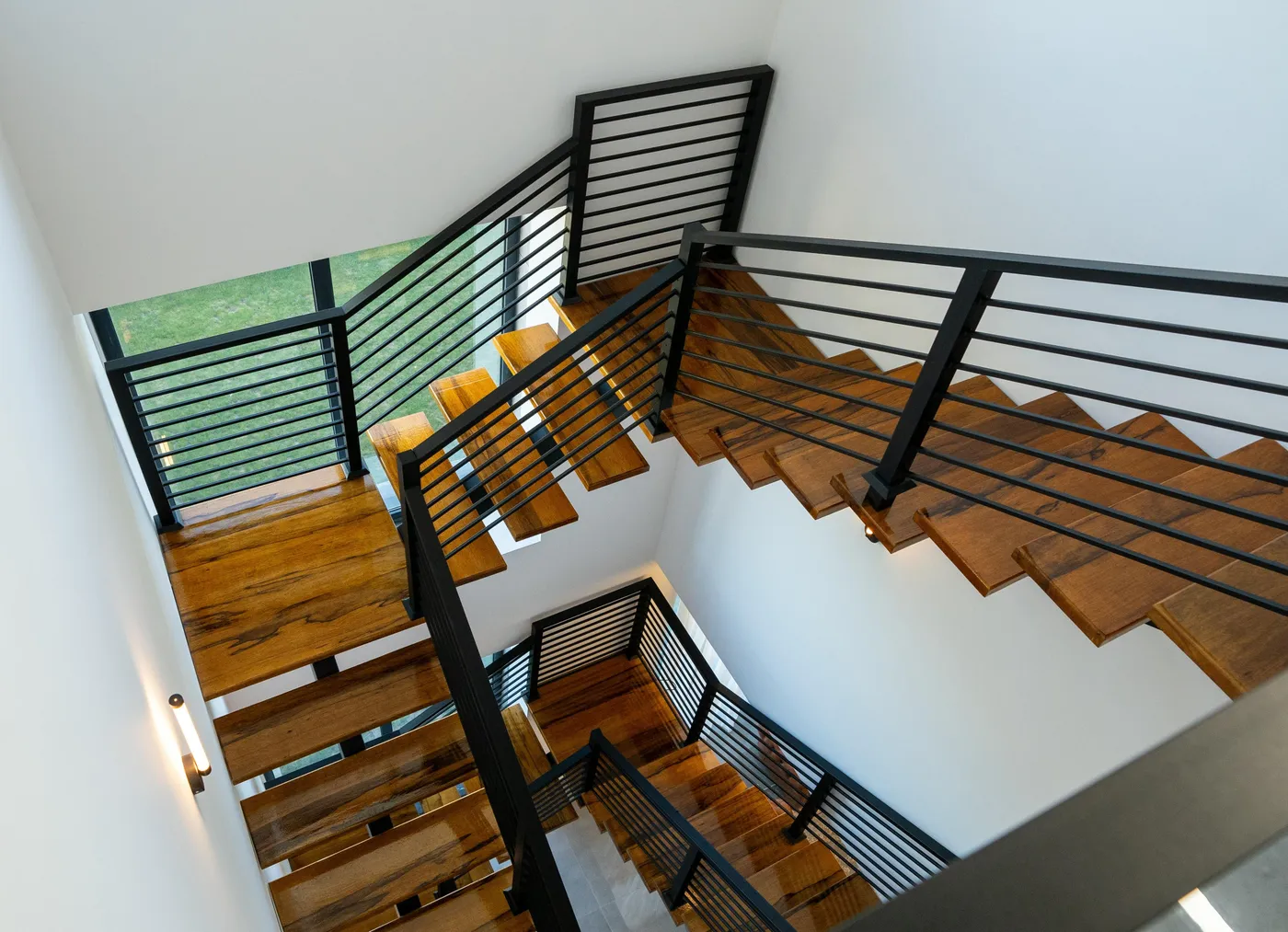 Custom floating stair installation in Palm Beach home